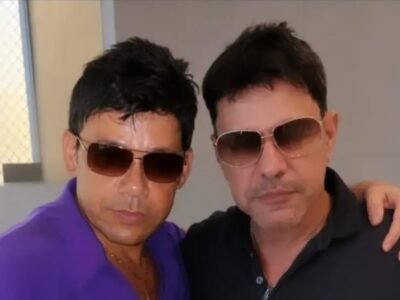 O sósia Zezé Mirosmeno, de camisa roxa, abraçado a Zezé Di Camargo, de camisa preta, os dois de óculos escuros
